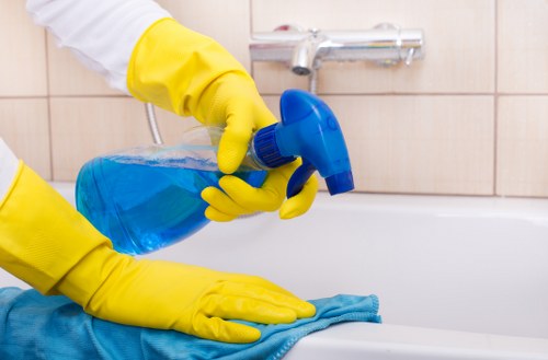 Kitchen surfaces being cleaned before move in cleaning in a new home